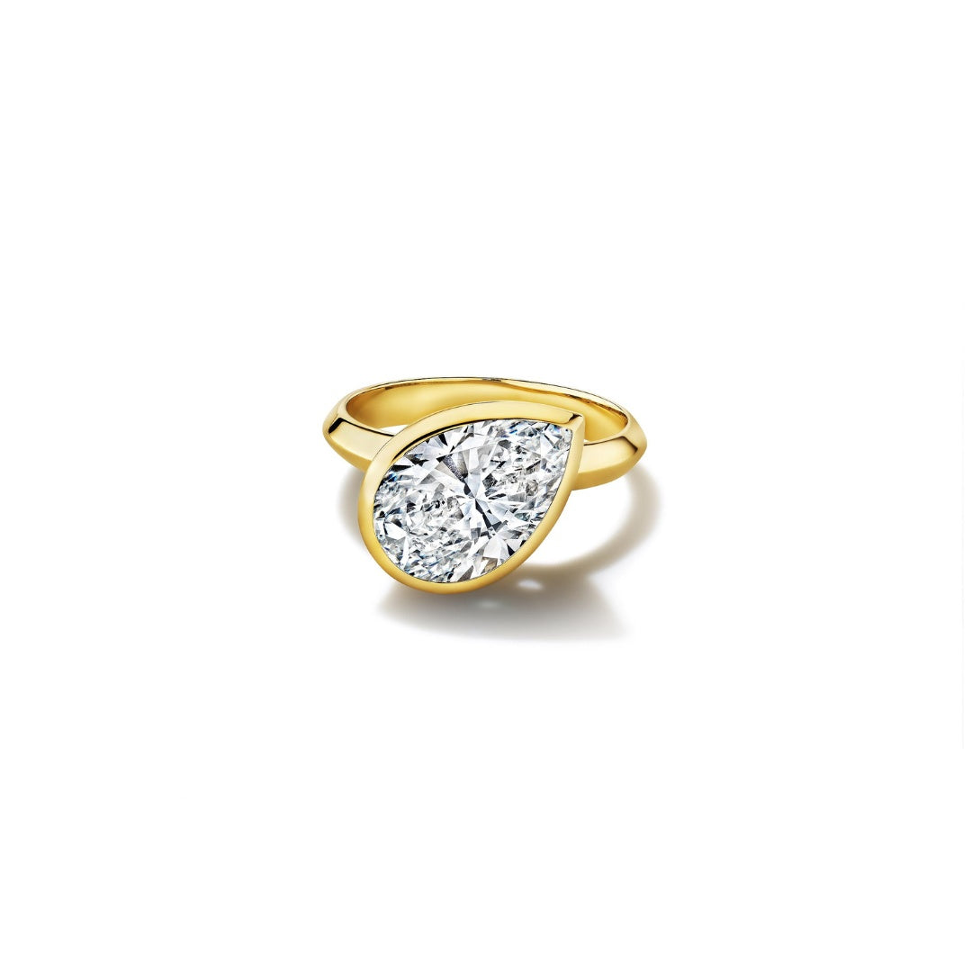 MoAnA LUU Dlo pear-shaped diamond ring in 18K yellow gold, featuring a cane-woven frame inspired by traditional Caribbean fish traps, reflecting the house’s vision of Creole-inspired fine jewelry crafted in New York.