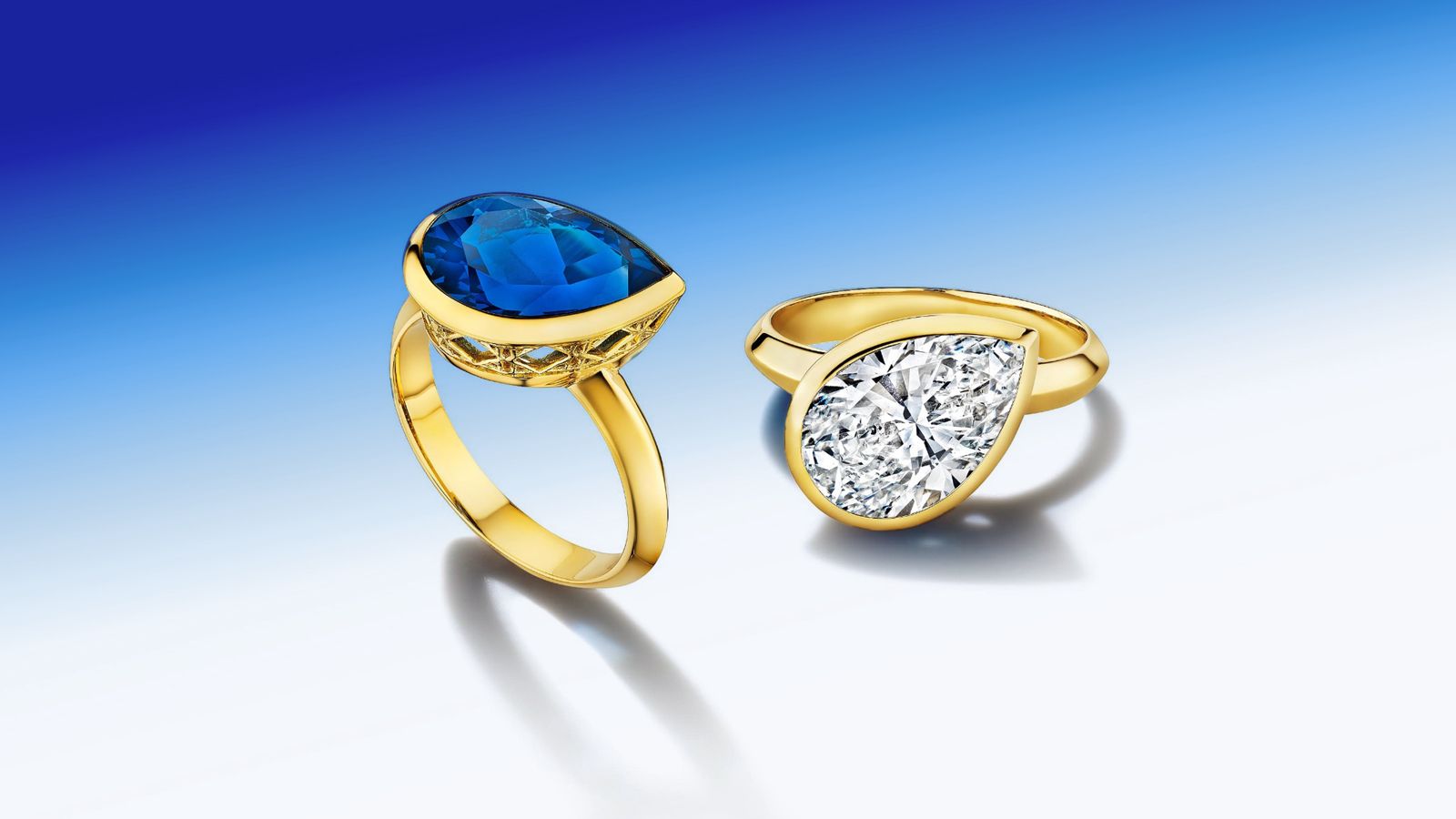 MoAnA LUU Dlo pear-shaped diamond and blue topaz rings in 18K yellow gold, featuring a cane-woven frame inspired by traditional Caribbean fish traps, reflecting the house’s vision of Creole-inspired fine jewelry crafted in New York.