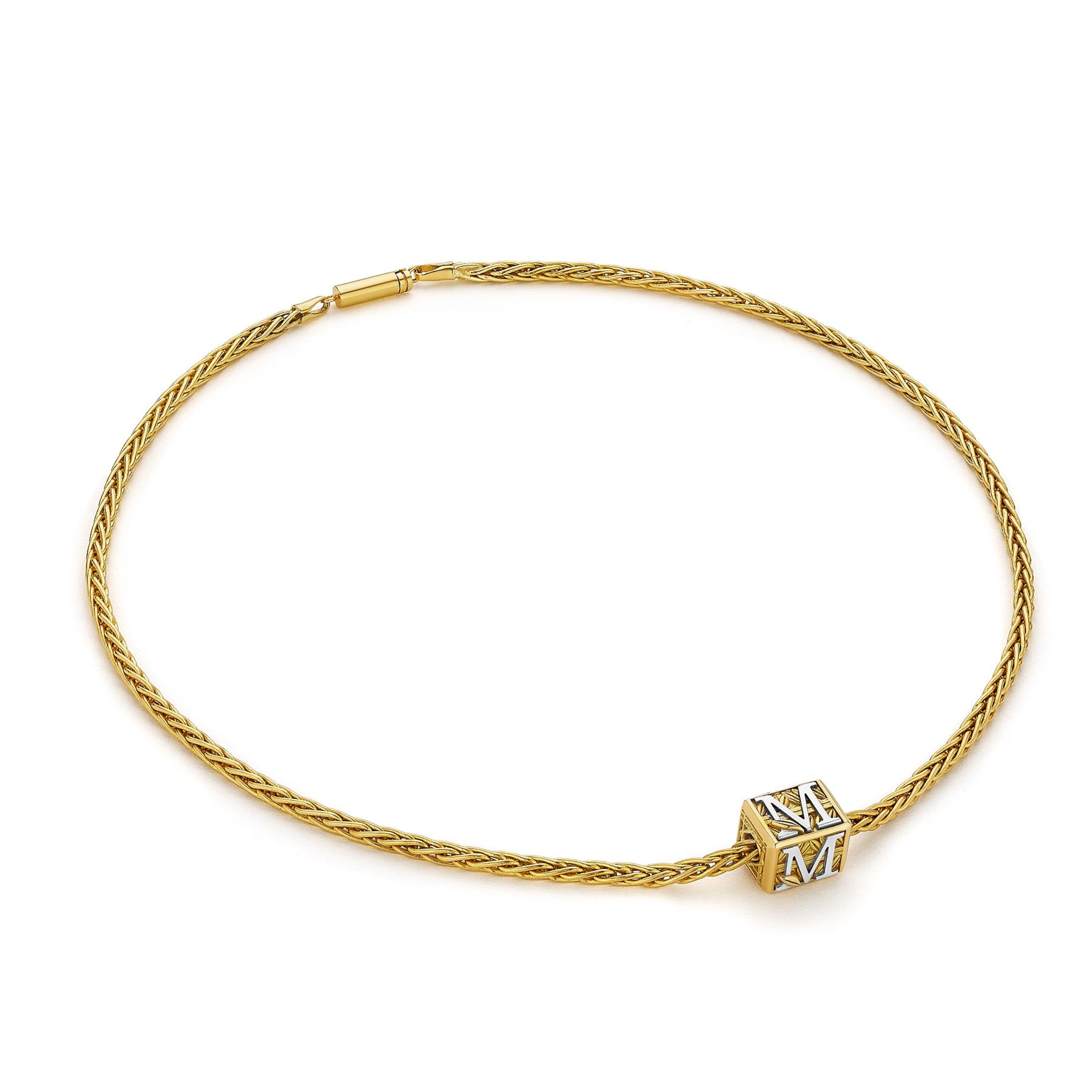 MoAnA LUU Foyal bead necklace in 18K yellow gold, featuring a wheat chain and “M” letter charm inspired by Creole architectural design.