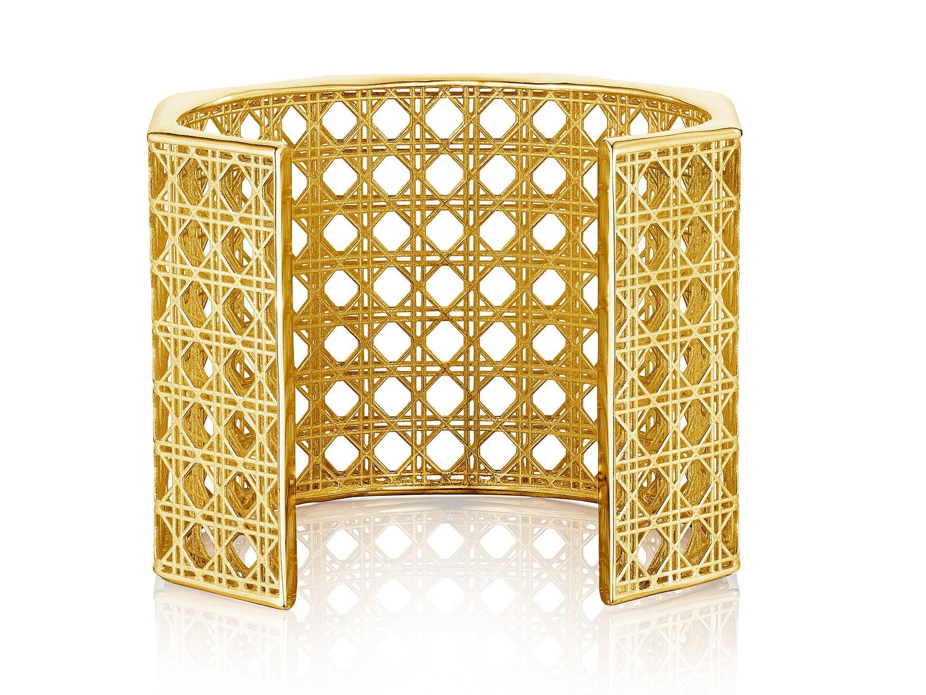 MoAnA LUU Doudou Maxi cuff bracelet in 18K yellow gold, featuring an intricate woven openwork design inspired by Caribbean fish traps.