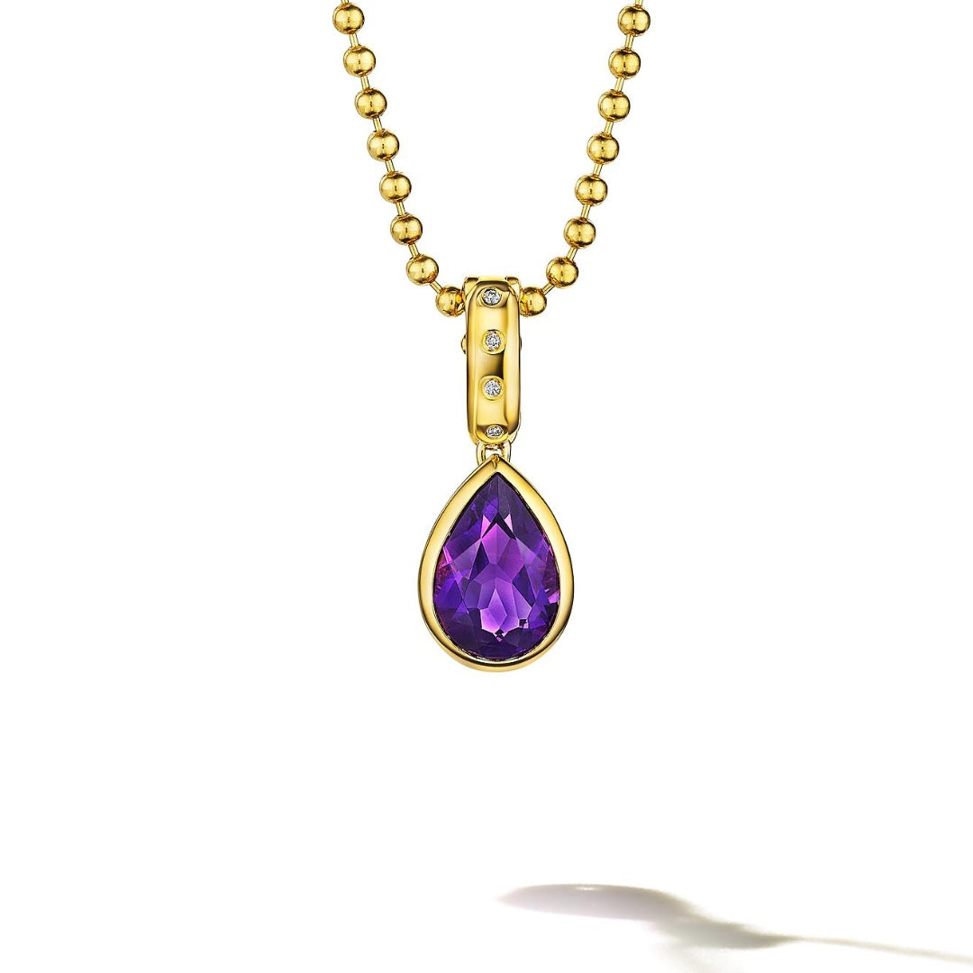 MoAnA LUU Dlo pear-shaped amethyst pendant in 18K yellow gold, featuring a cane-woven frame inspired by traditional Caribbean fish traps, reflecting the house’s vision of Creole-inspired fine jewelry crafted in New York.