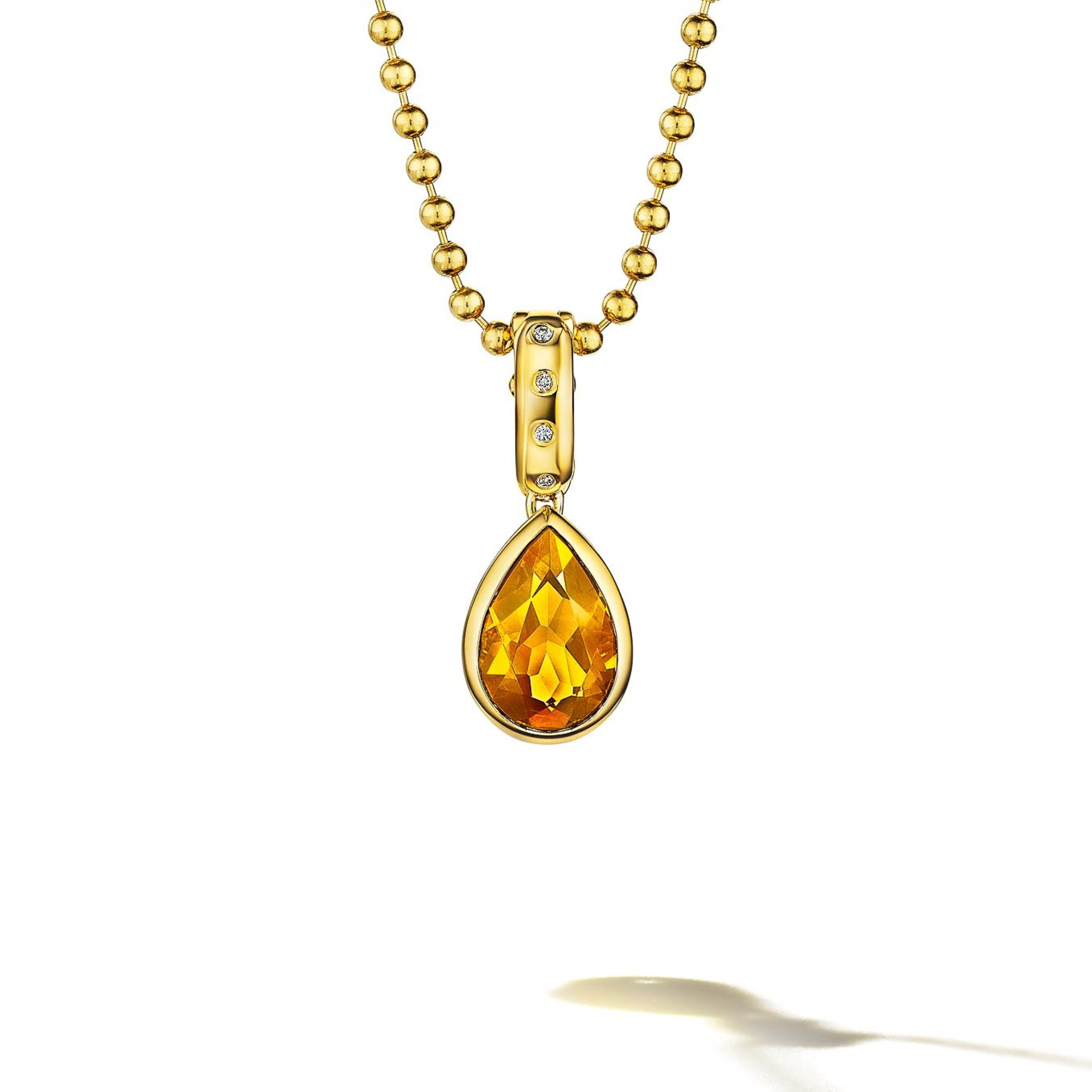 MoAnA LUU Dlo pear-shaped citrine pendant in 18K yellow gold, featuring a cane-woven frame inspired by traditional Caribbean fish traps, reflecting the house’s vision of Creole-inspired fine jewelry crafted in New York.