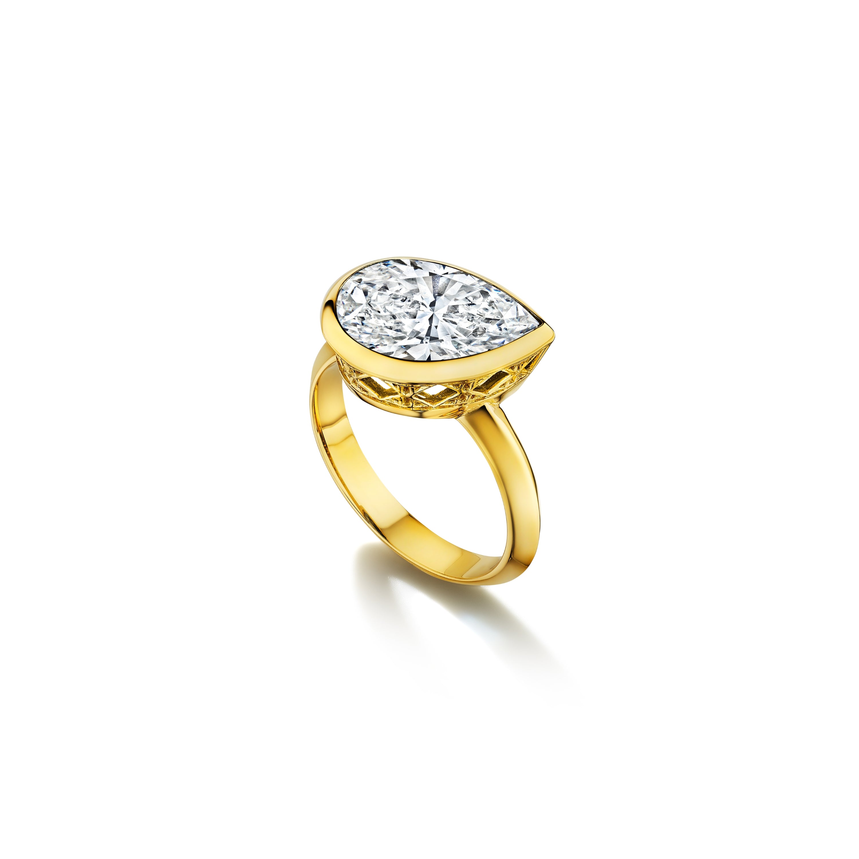 MoAnA LUU Dlo pear-shaped diamond ring in 18K yellow gold, featuring a cane-woven frame inspired by traditional Caribbean fish traps, reflecting the house’s vision of Creole-inspired fine jewelry crafted in New York.