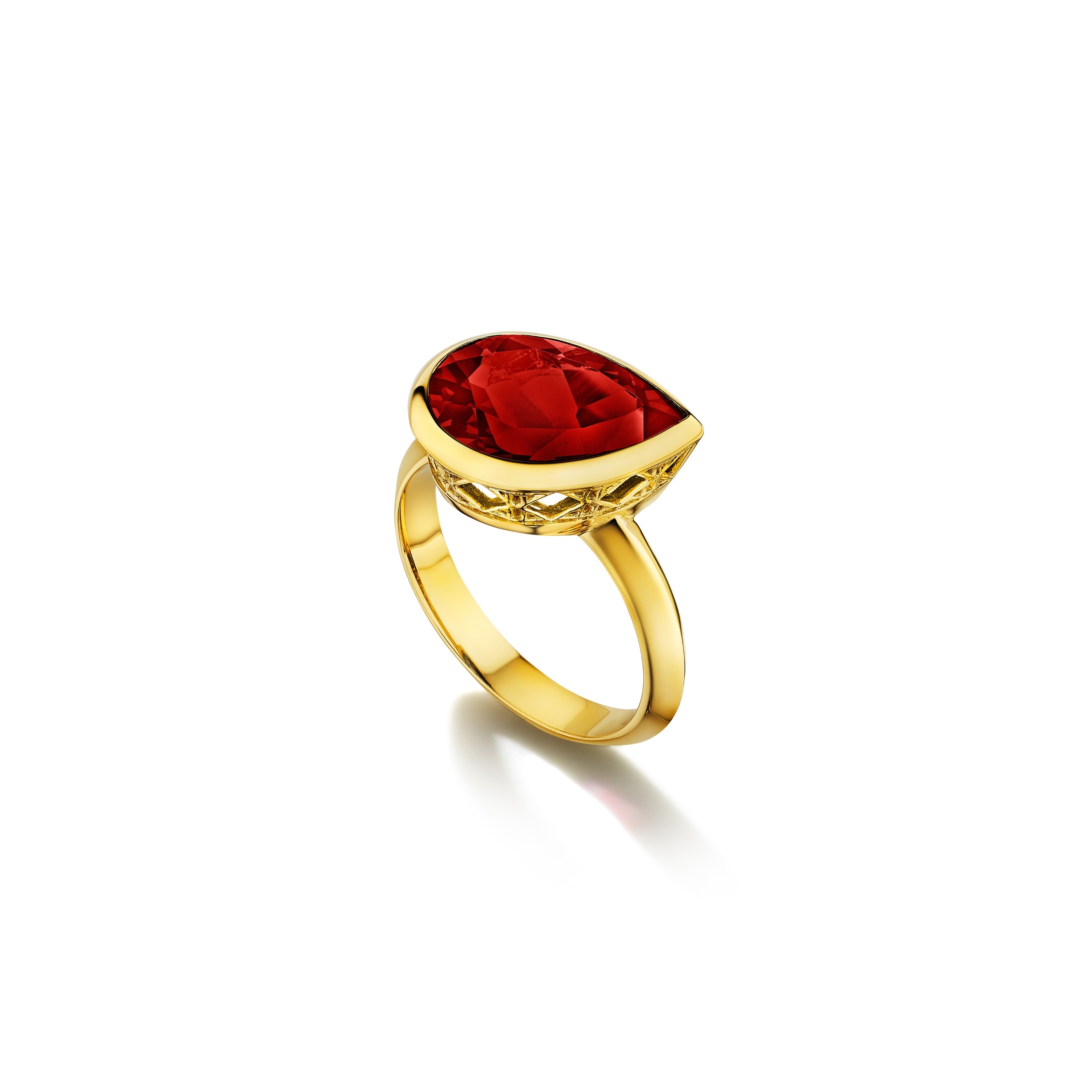MoAnA LUU Dlo pear-shaped ruby ring in 18K yellow gold, featuring a cane-woven frame inspired by traditional Caribbean fish traps, reflecting the house’s vision of Creole-inspired fine jewelry crafted in New York.