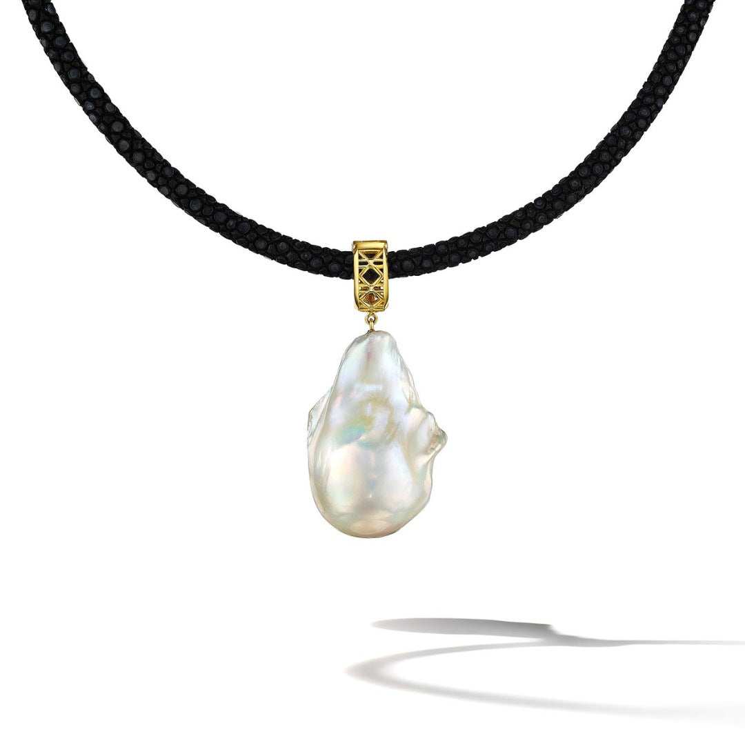MoAnA LUU Abyss baroque pearl pendant on black stingray leather cord with 18K yellow gold cane woven bail, inspired by traditional Caribbean fish traps.