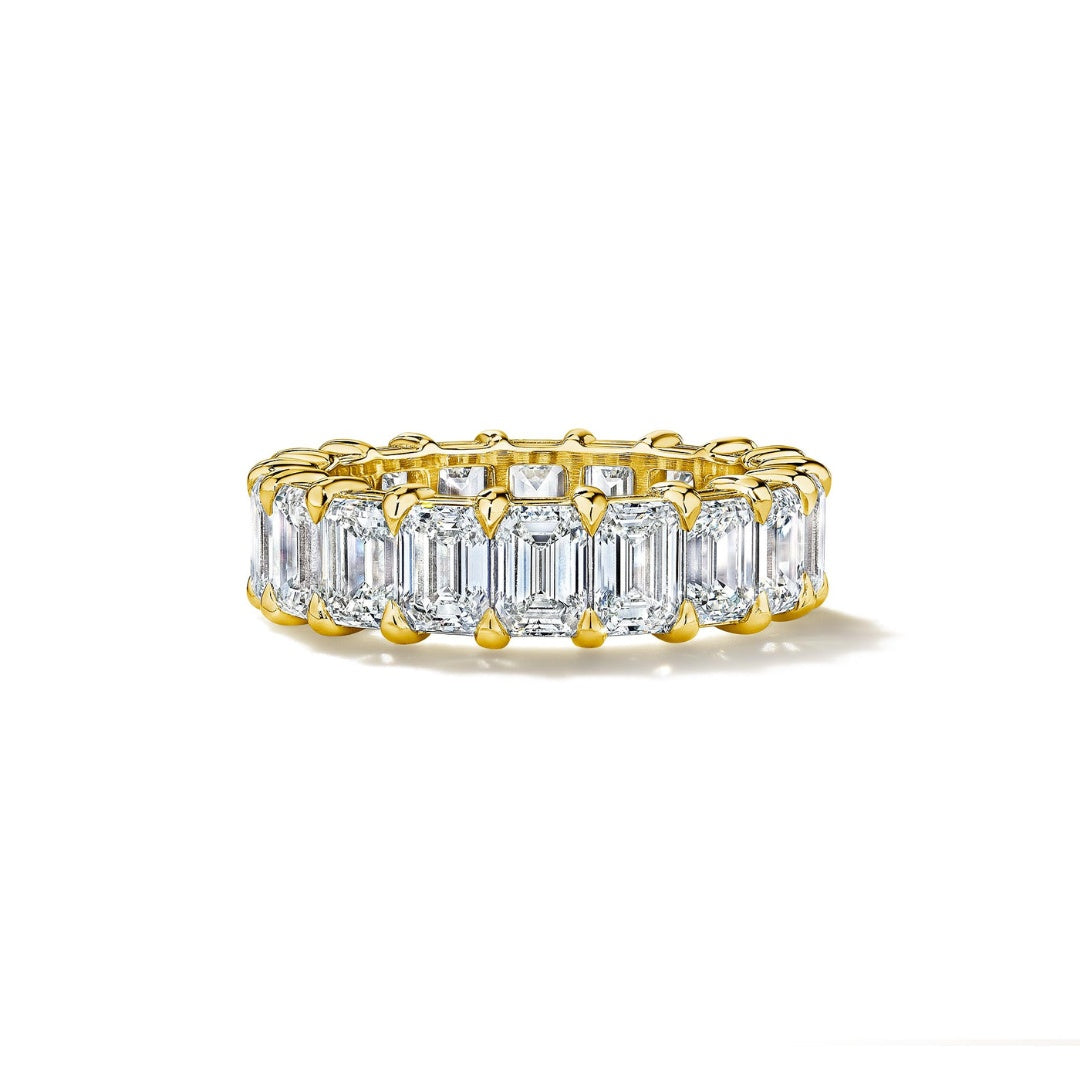 MoAnA LUU emerald cut diamond eternity band in 18K yellow gold.