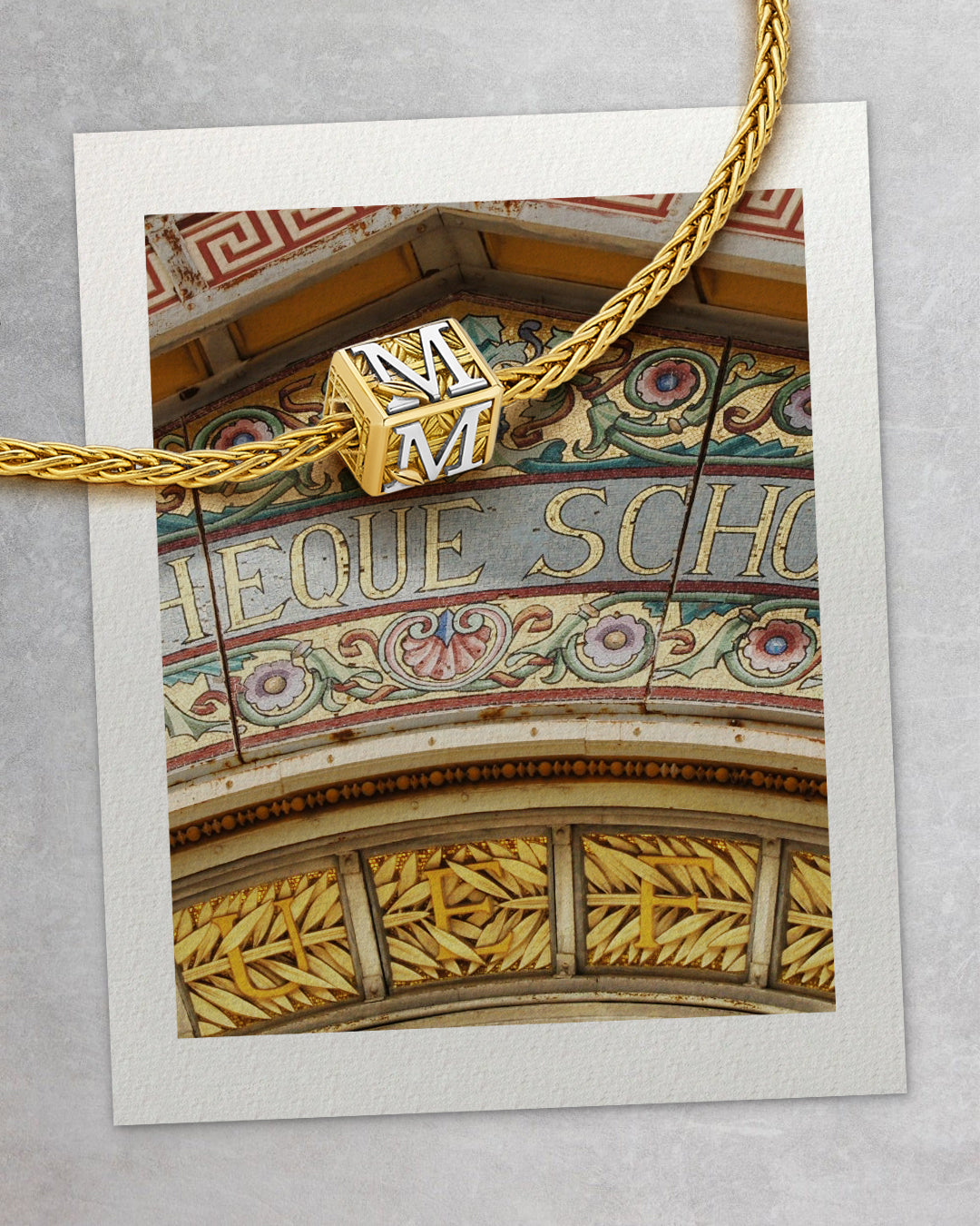 MoAnA LUU Foyal bead necklace over vintage postcard showing Bibliotheque Schoelcher