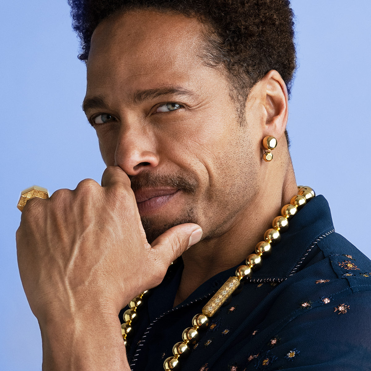 Gary Dourdan in MoAnA LUU beads necklace and earrings and ML embossed statement ring. 