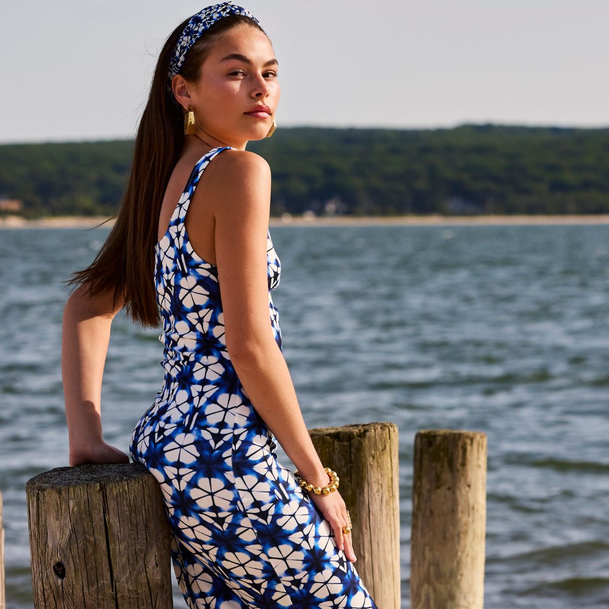 Model wearing MoAnA LUU beads bracelet and hoop earrings in vermeil. Make in New York City. 