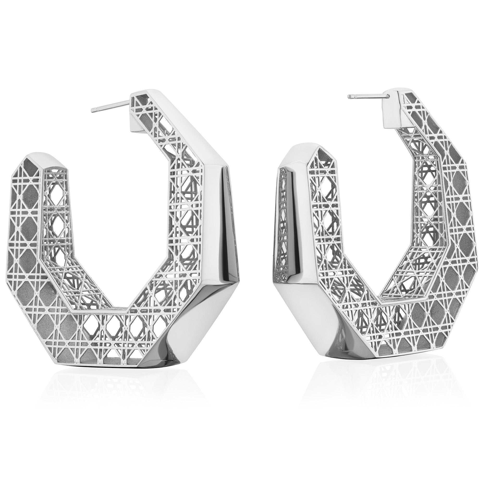 MoAnA LUU Doudou Creole Mama Hoop earrings in silver, featuring a cane-woven work inspired by traditional Caribbean fish traps, reflecting the house’s vision of Creole-inspired jewelry crafted in New