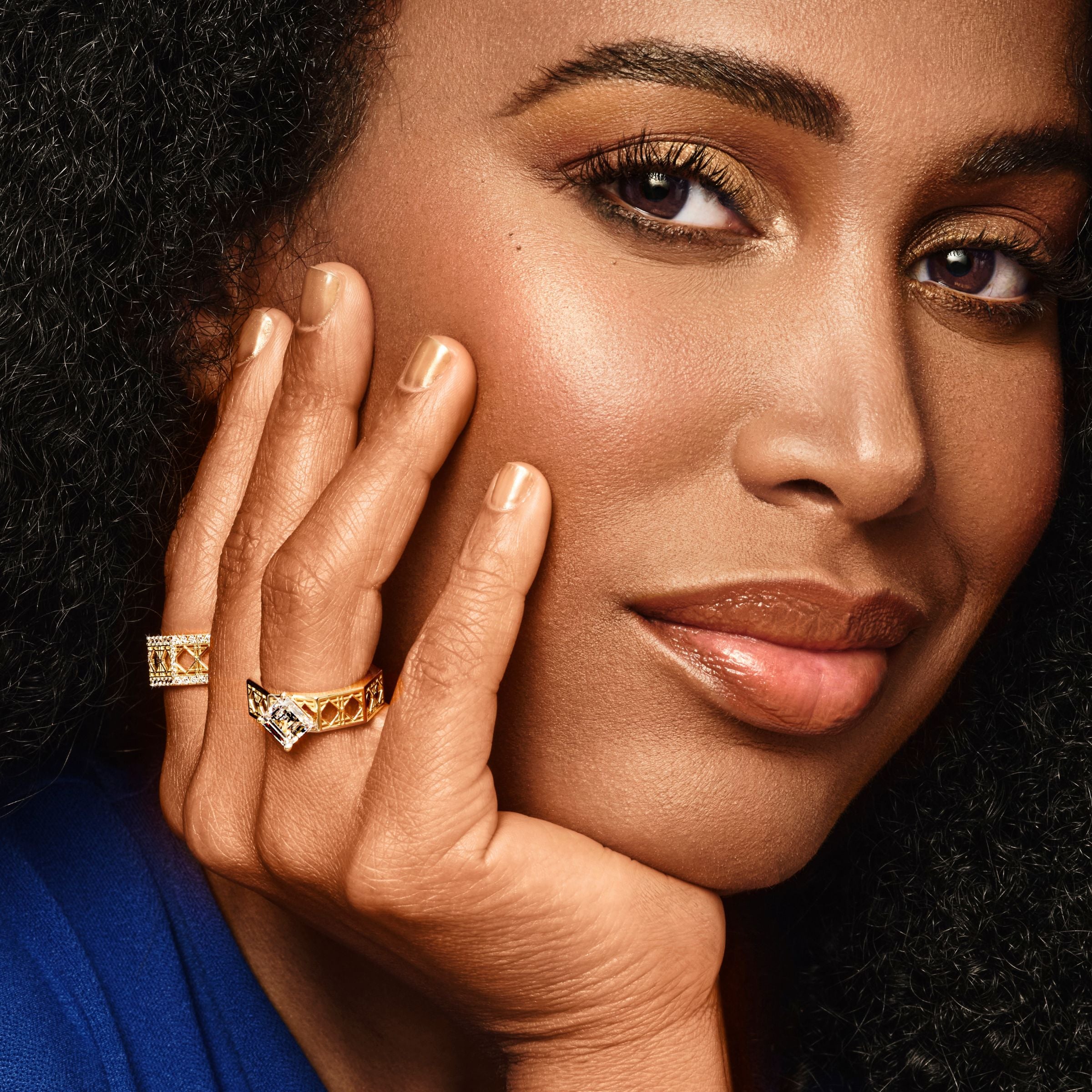 MoAnA LUU wearing MoAnA LUU Doudou  rings in 18K yellow gold, featuring geometric woven openwork design inspired by Caribbean fish traps.