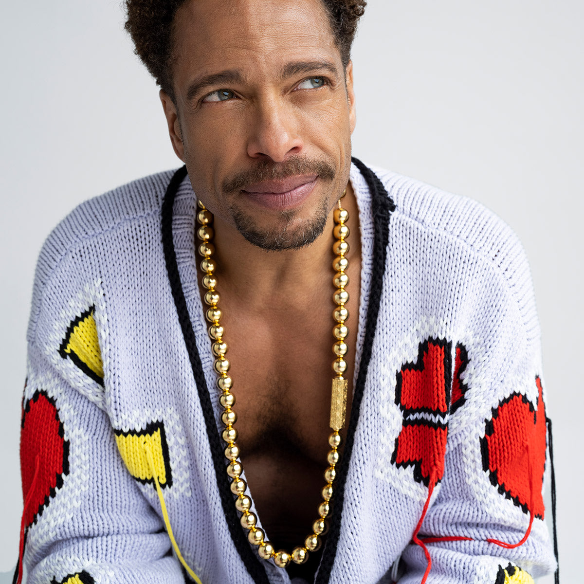 Gary  Dourdan wearing MoaAnA LUU long bead necklace in vermeil. Inspired by Creole jewelry. 